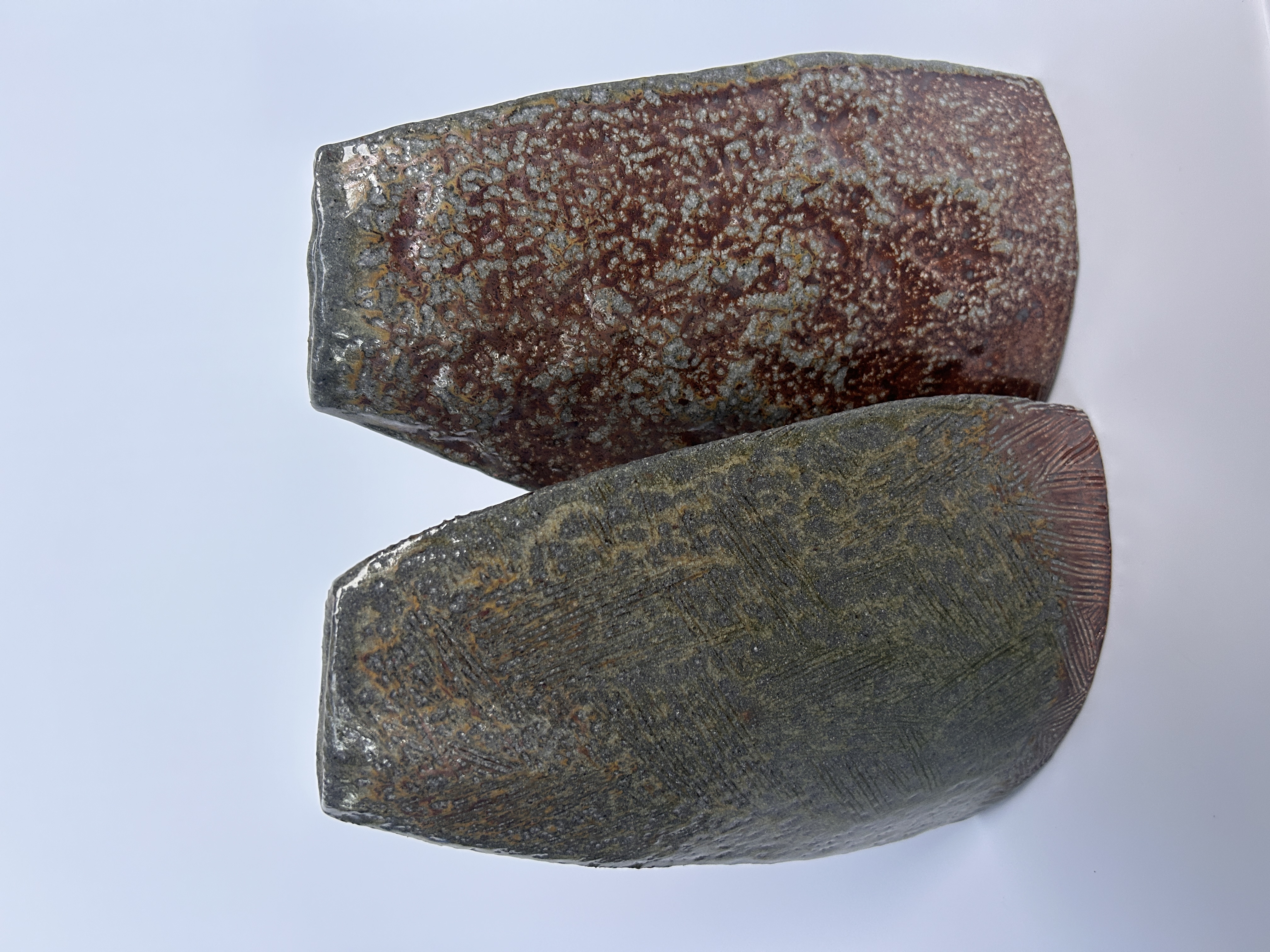 Pair of ceramic forms with speckled glaze