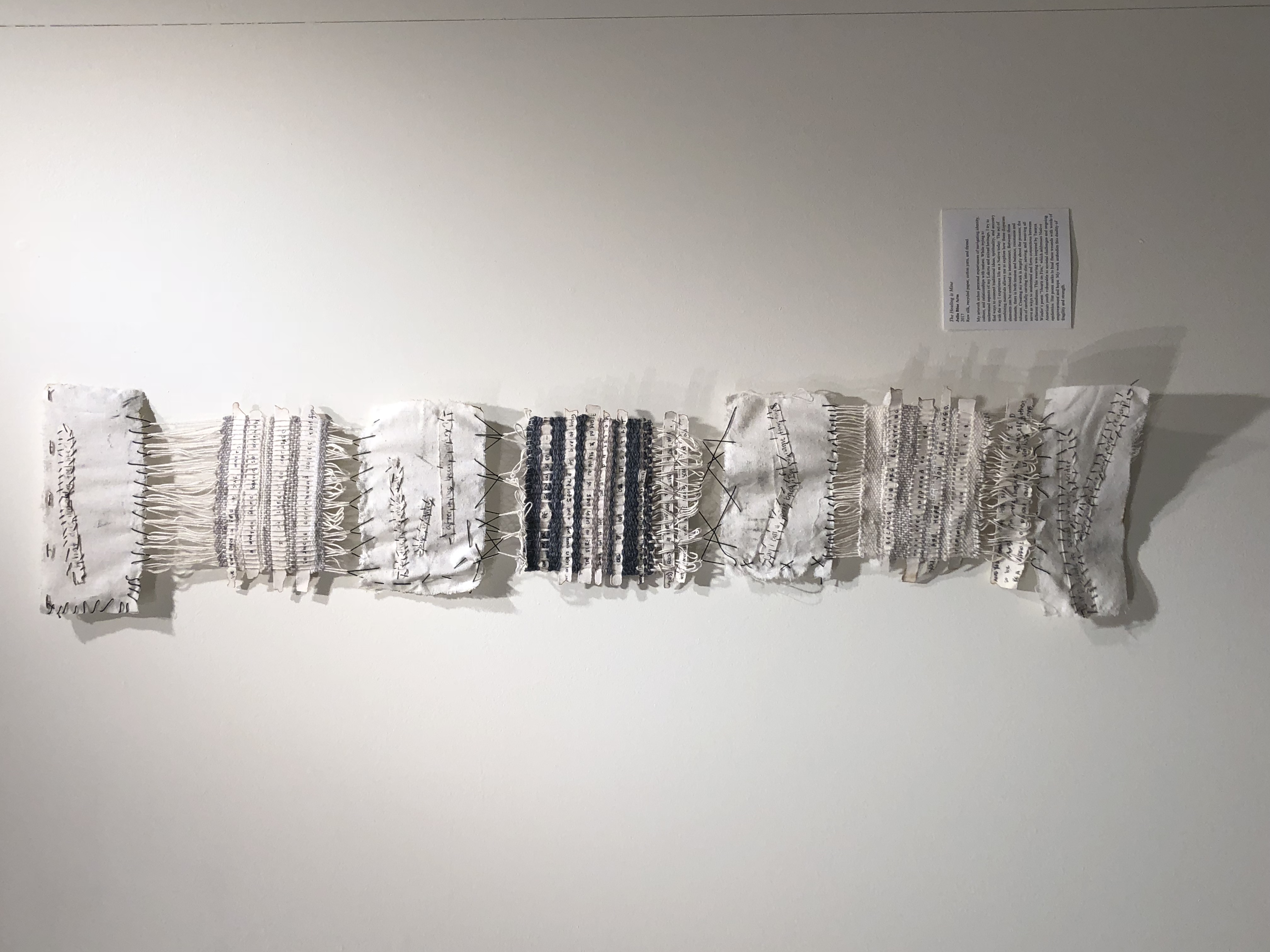 Horizontal textile panel with stitched and sewn sections in white